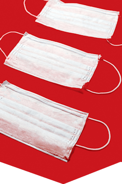 Face masks laid on red background